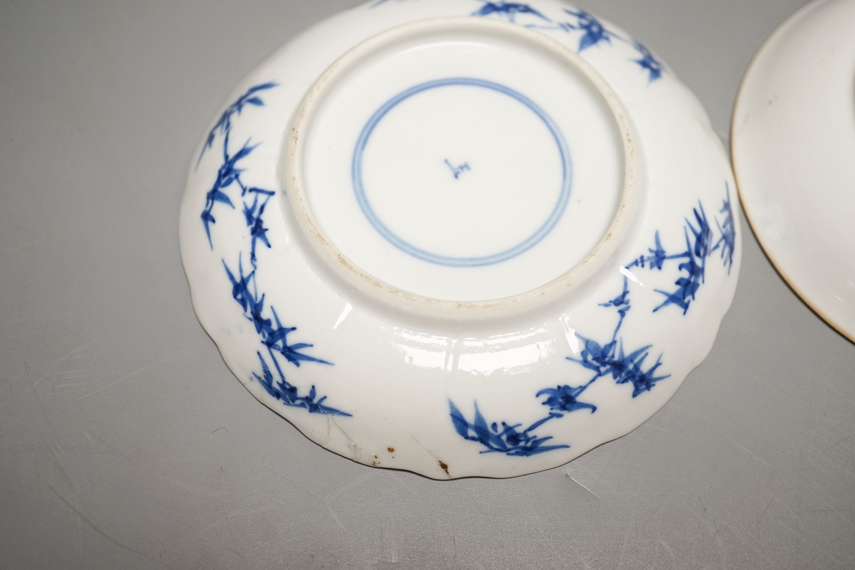 Two Chinese porcelain saucer dishes and an enamelled porcelain vase, 18th century and later, 12.5cm